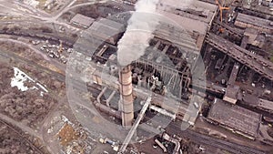 Aerial view. Emission to atmosphere from industrial pipes. Smokestack pipes shooted with drone. Close-up.