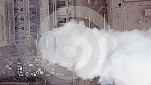 Aerial view. Emission to atmosphere from industrial pipes. Smokestack pipes shooted with drone. Close-up.