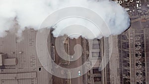 Aerial view. Emission to atmosphere from industrial pipes. Smokestack pipes shooted with drone. Close-up.