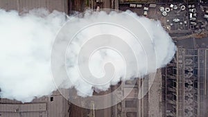 Aerial view. Emission to atmosphere from industrial pipes. Smokestack pipes shooted with drone. Close-up.