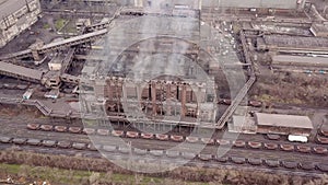 Aerial view. Emission to atmosphere from industrial pipes. Smokestack pipes shooted with drone. Close-up.