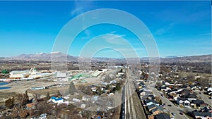 Aerial view of Emmett, Idaho, looking south along the railroad tracks to the left of Main Street