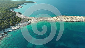 Aerial view of Emplisi Beach, picturesque stony white pebble beach