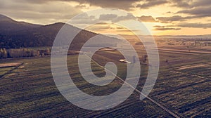 Aerial view of empty autumn fields at sunset.