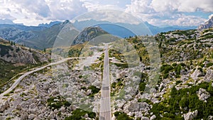 Aerial view of empty road in mountains at sunset in summer