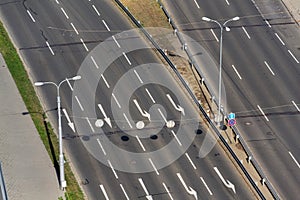 White arrows on driving lanes on empty road, autonomous technology photo