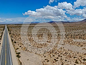 Aerial view of endless straight road in the desert of Joshua Tree Park. USA
