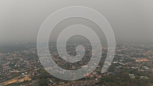 Aerial view of an environment in Chiang Rai city covered with bad air pollution such as PM 2.5.