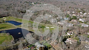 Aerial view Establishing shot of american neighborhood, suburb. Real estate, golf course, drone shots,