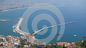 Aerial view of european coast - sea sight - beautiful landscape - old architecture - sunny day. Harbor from Alanya peninsula.