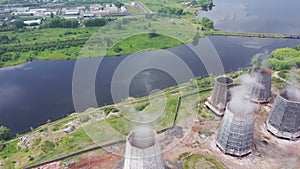 Aerial view of evaporating water from cooling tower of metallurgical plant