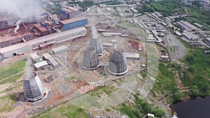 Aerial view of evaporating water from cooling tower of metallurgical plant