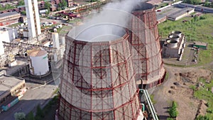 Aerial view of evaporating water from a cooling tower of a metallurgical plant
