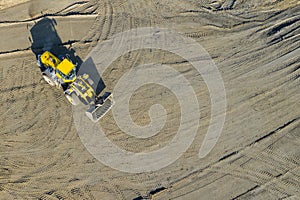 Aerial view of excavator and construction equipment. Machinery and mine equipment from above. Top view of industrial place. Photo