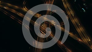 Aerial view of an expressway with little car traffic at night.