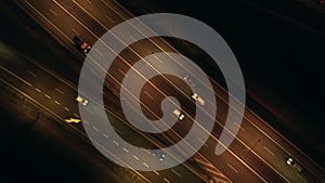 Aerial view of an expressway with little car traffic at night.