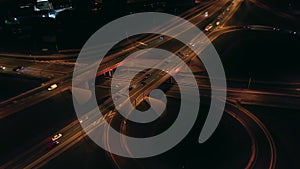 Aerial view of an expressway with little car traffic at night.