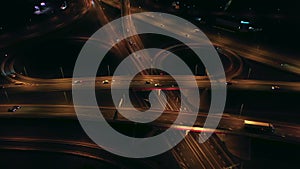 Aerial view of an expressway with little car traffic at night.