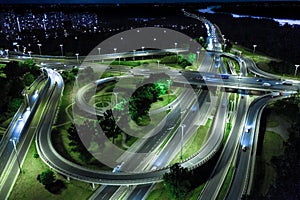 Aerial view Expressway motorway highway circus intersection at Night time Top view , Road traffic in city