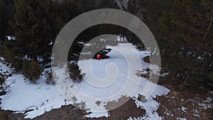 Aerial view of an extreme skier rides on the grass on a slope where there is no snow. An innovative type of skiing on