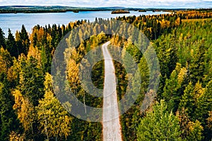 Aerial view of fall road with beautiful autumn forest