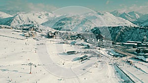 Aerial view of famous crowded Alpe d'Huez ski resort on a winter sunny day, France photo