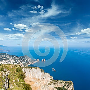 Aerial view of famous Faraglioni rocks from Monte Solaro at Capri island, Italy.