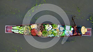 Aerial view famous floating market in Thailand, Damnoen Saduak floating market, Farmer go to sell organic products, fruits, photo