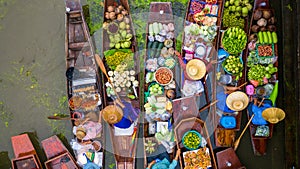 Aerial view famous floating market in Thailand, Damnoen Saduak floating market, Farmer go to sell organic products, fruits, photo