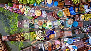 Aerial view famous floating market in Thailand, Damnoen Saduak floating market, Farmer go to sell organic products, fruits, photo