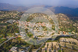 Aerial view of famous landmark valley Pano Lefkara village, Larnaca, Cyprus with orange ceramic roofs, drone photo