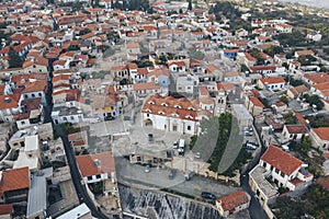 Aerial view of famous landmark valley Pano Lefkara village, Larnaca, Cyprus with orange ceramic roofs, drone photo