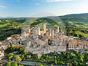 Aerial view of famous medieval San Gimignano hill town with its skyline of medieval towers, including the stone Torre Grossa. photo