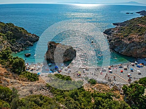 Aerial view of the famous rocky beach Foneas near Kardamyli village in the seaside Messenian Mani area during high tourist Summer