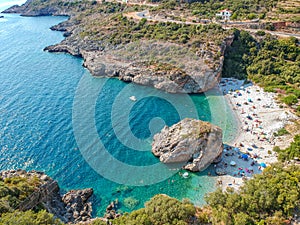 Aerial view of the famous rocky beach Foneas near Kardamyli village in the seaside Messenian Mani area during high tourist Summer