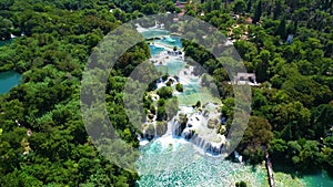 Aerial view of famous waterfalls Krka,  National Park in Croatia. Summer season, crystal clear turquoise water surrounded by green