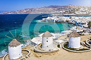 Aerial view through the famous windmills above Mykonos town, Greece