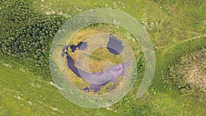 Aerial view of a fantastic lake that seems to be laughing cunningly.