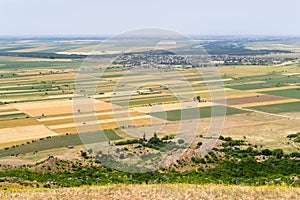 Aerial view of farm lands with crop fields in Dobrogea, Romania. Agriculture in south-east of Europe