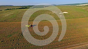 AERIAL VIEW. Farm Machinery Cutting Field At Harvest