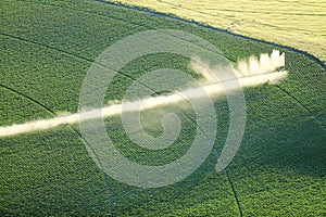 An aerial view of farmland irrigated with center pivot sprinkler systems.