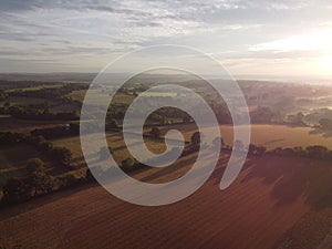 Aerial view of farmland during a marvelous sunset in Boarhunt, Hampshire, UK