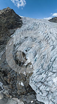 Aerial view of the Fellaria glacier in Valmalenco, Sondrio, Lombardy. Italy. Ice cliff, rock face with waterfalls and lake photo