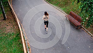 Aerial view of female runner backwards