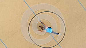 Aerial view of a female teenager in rope skipping