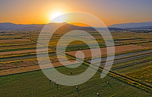 Aerial view of the fields near Sinj with hay bales in the countryside, Croatia