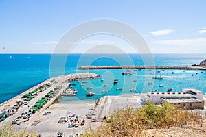 Aerial view of fihsing boats in the Porto de Abrigo de Albufeira, Albufeira Bay in Albufeira, Portugal photo