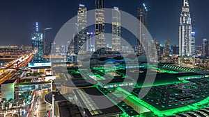 Aerial view of Financial center road night timelapse with under construction buildings