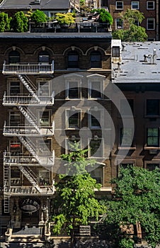 Aerial view of fire escape ladders and balconies in a residential building in Midtown Manhattan, New York, USA