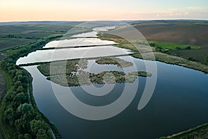 Aerial view of fish hetching pond with blue water in aquacultural area